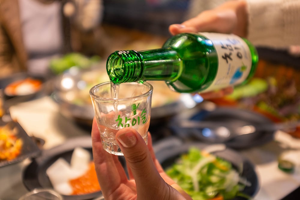 Soju-being-poured-–-lead